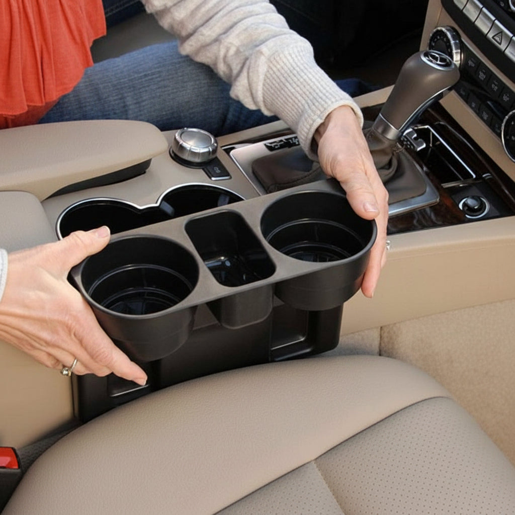 Person holding a car cup holder organizer with multiple cup holders.