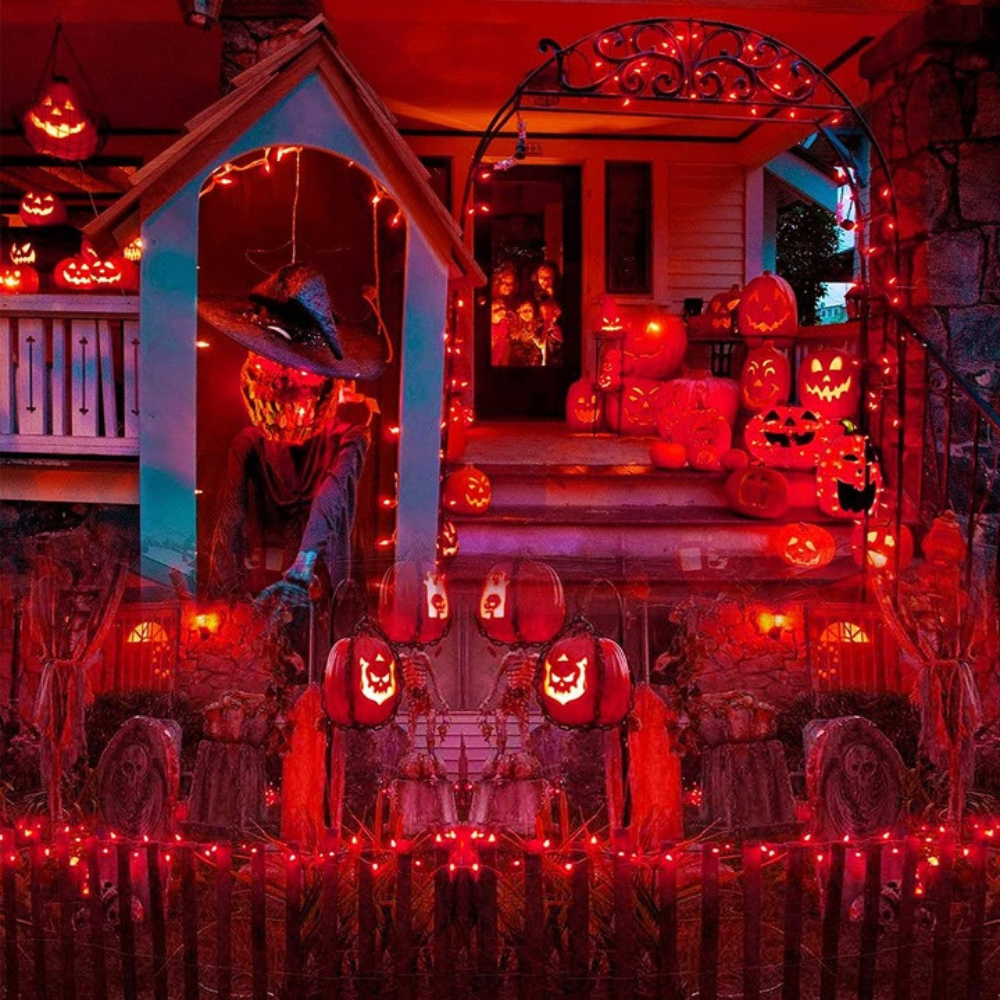 Halloween-themed house exterior with lit pumpkins and decorations.