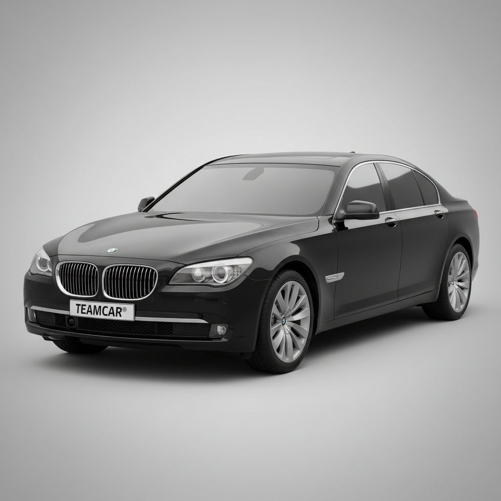 Black BMW car with 'TEAMCAR' license plate on a gray background