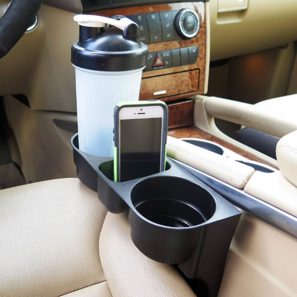 Car cup holder organizer with phone, cup, and shaker bottle inside a vehicle.
