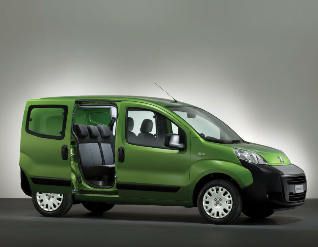Green Fiat Fiorino Combi (225) 2008-2019 with open door on a gray background