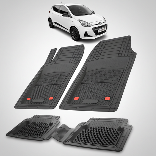 Set of black car floor mats with a white car in the background