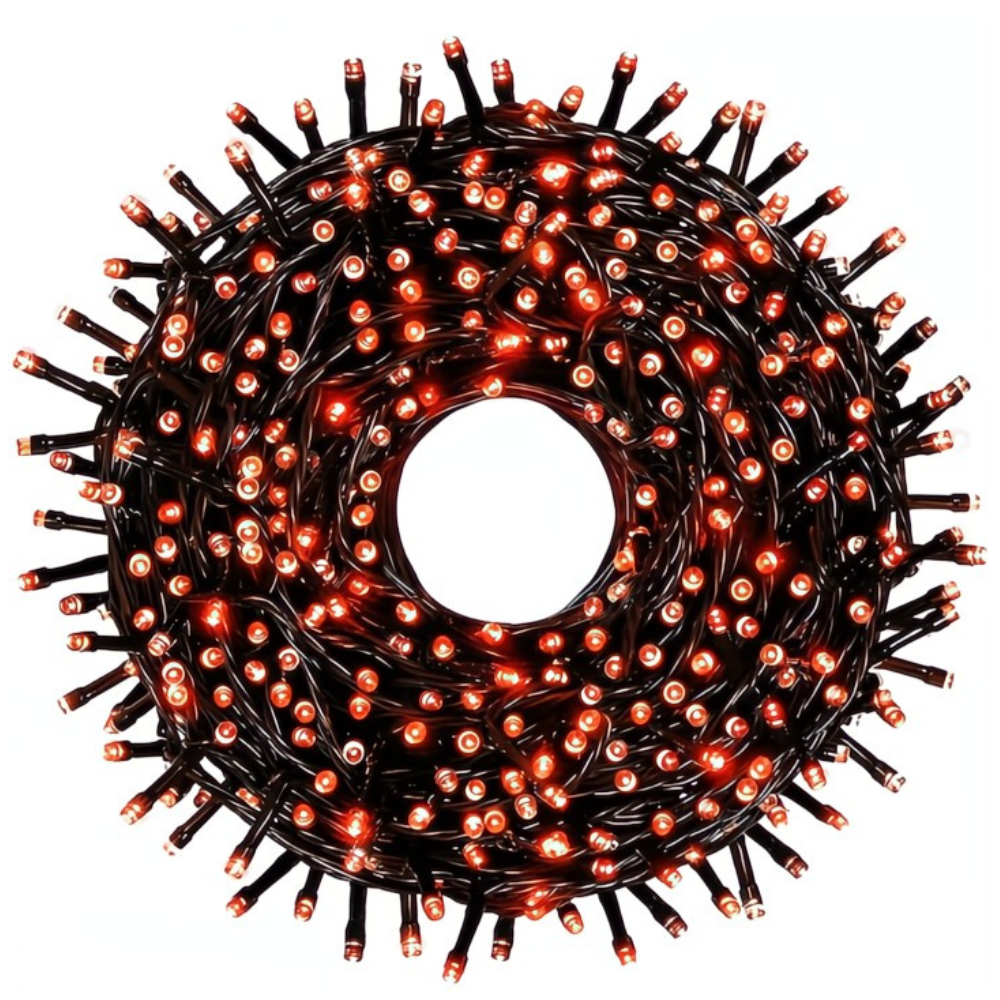 Coiled string of orange Christmas lights on a white background