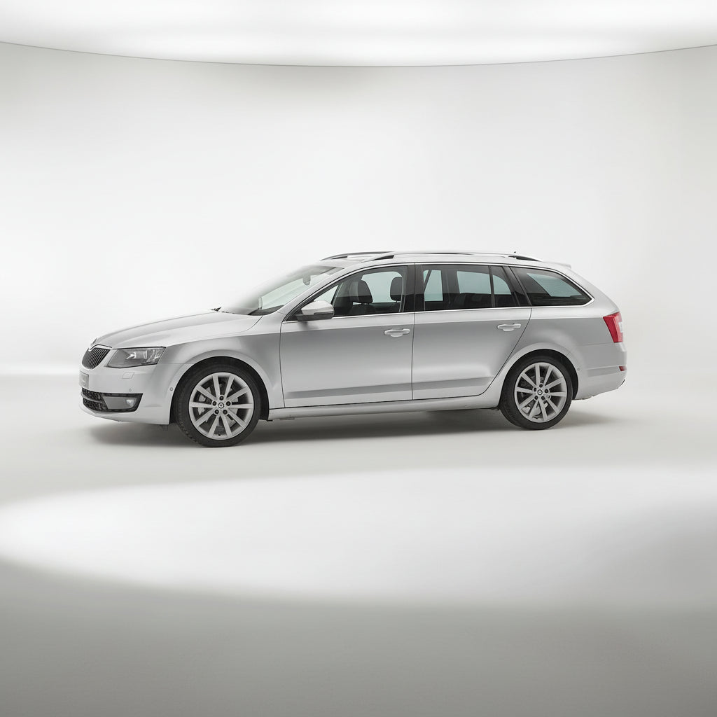 Silver Skoda Octavia III Combi (2013–2016) on a white background