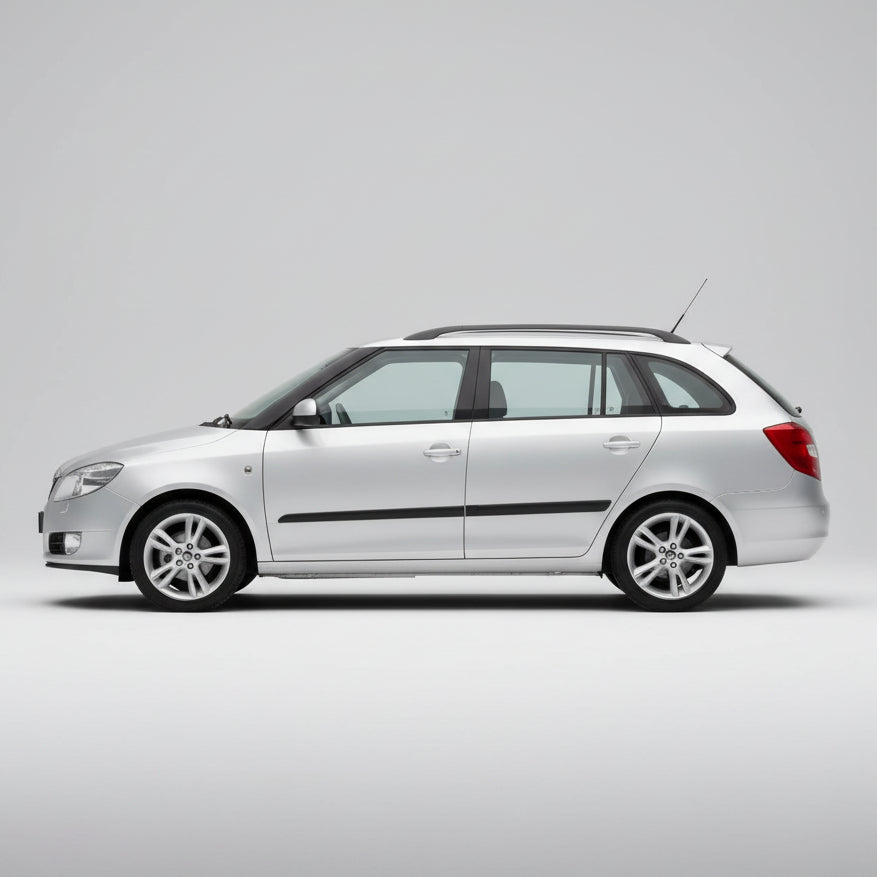 White Skoda Fabia II Combi (2007–2014) on a gray background