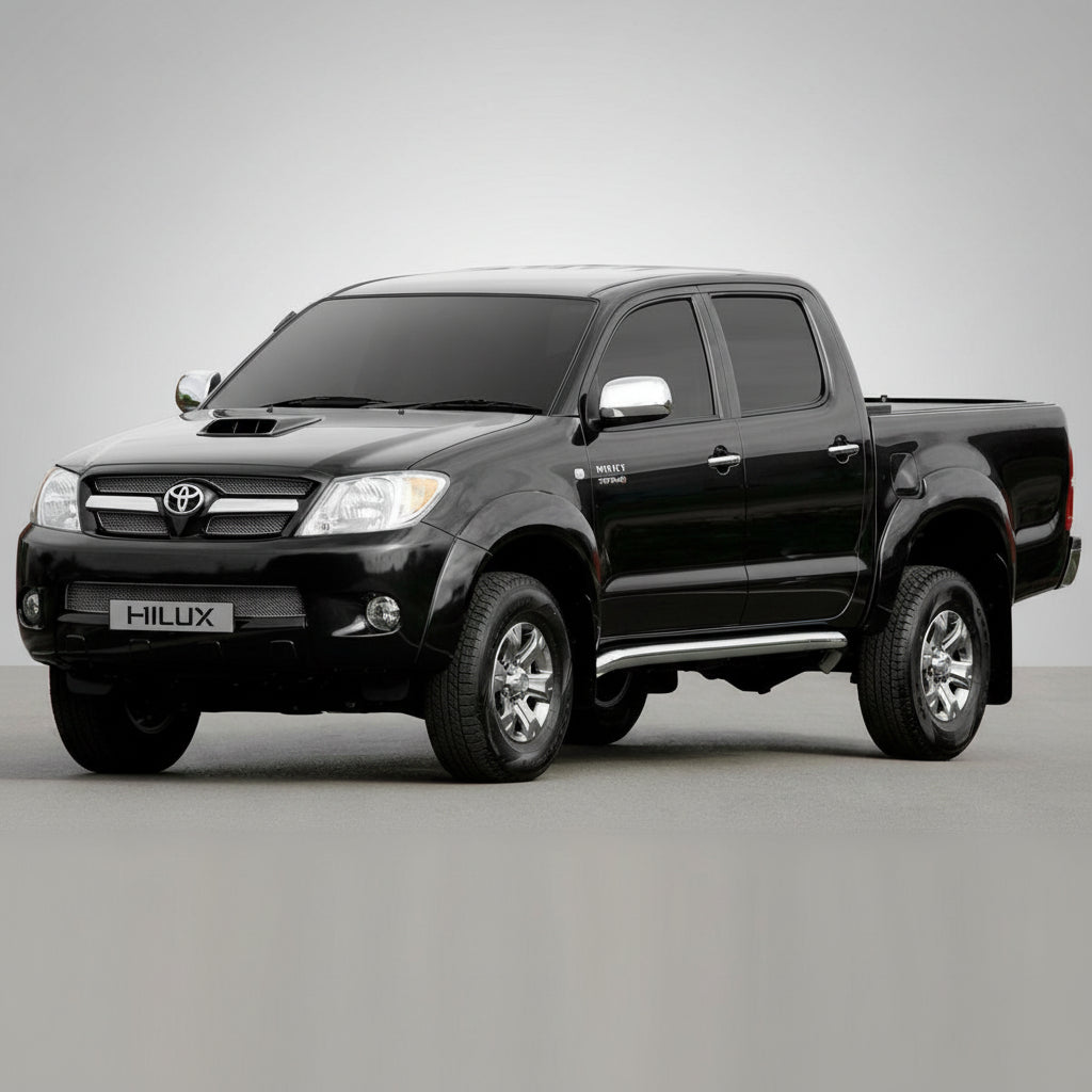Black Toyota Hilux pickup truck on a gray surface 