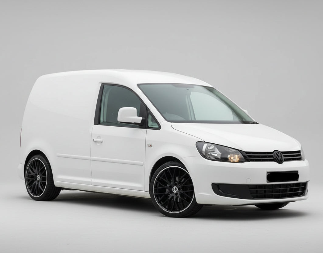 White Volkswagen Caddy IV Panel Van (2015–2020) van with black wheels on a gray background