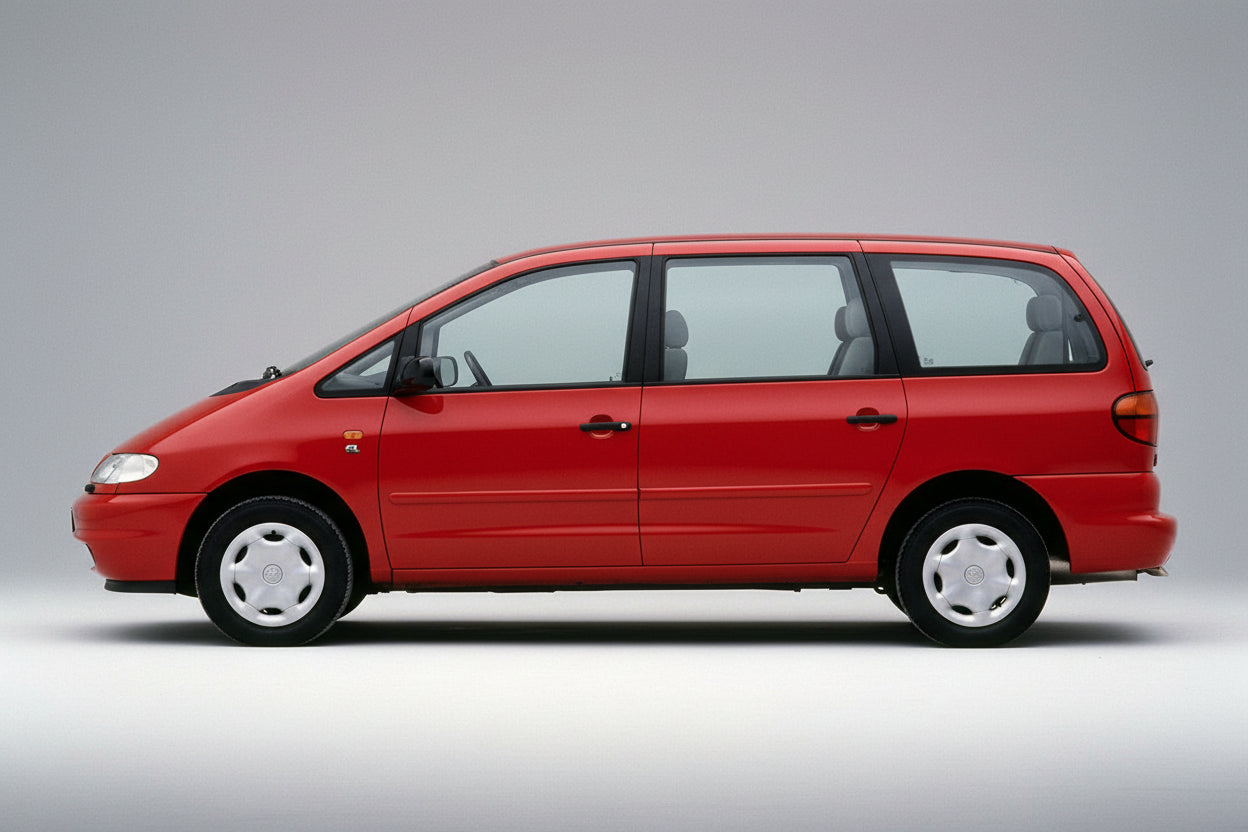 Red Volkswagen Sharan (7M8) 1995-2001 minivan on a gray background