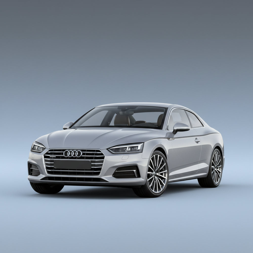 Silver Audi car on a road with a mountainous background