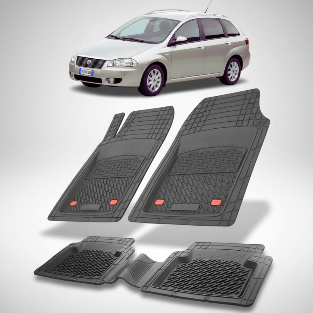 set de covorase din cauciuc negre cu un fiat croma station wagon gri in fundal