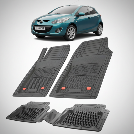 set de covorase din cauciuc negre cu o mazda 2 de facelift hatchback 5 usi albastru verzui  in fundal