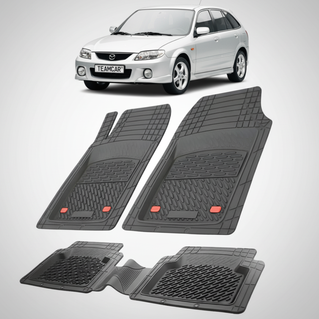 set de covorase din cauciuc negre cu o mazda 323 bj facelift hatchback 5 usi argintie in fundal