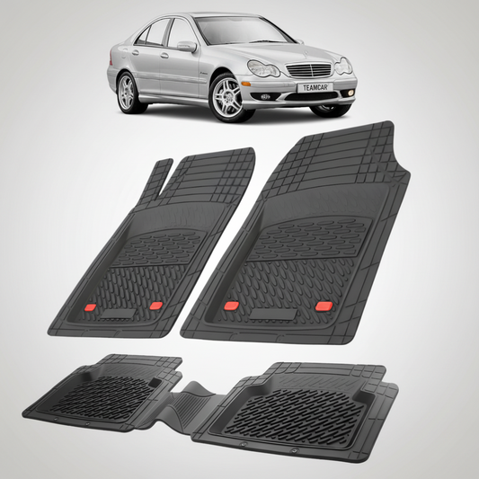 Set of black car floor mats with a silver car in the background