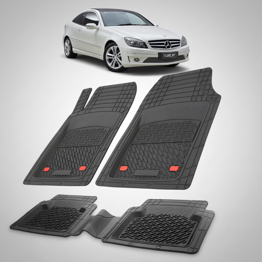 Set of black car floor mats with a white car in the background