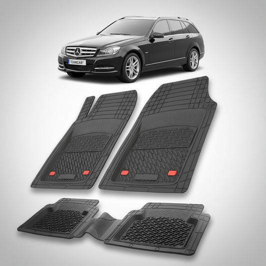 Set of black car floor mats with a Mercedes-Benz car in the background.