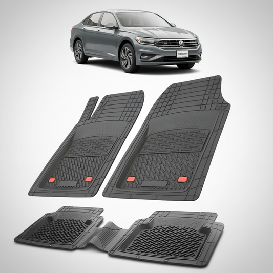 set de covorase din cauciuc negre cu un volkswagen jetta 7 sedan gri inchis in fundal