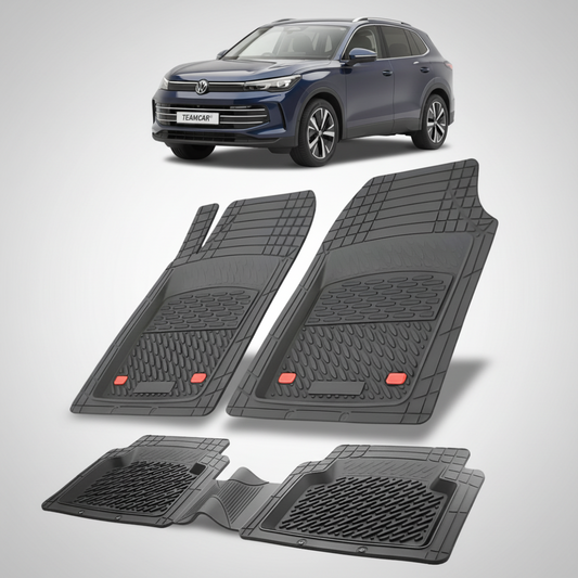 set de covorase din cauciuc negre cu un volkswagen tiguan bw3 suv albastru inchis in fundal