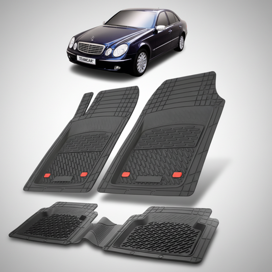 Set of black car floor mats with a car in the background