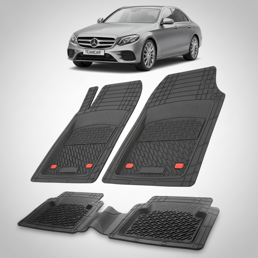 Set of black car floor mats with a Mercedes-Benz car in the background.