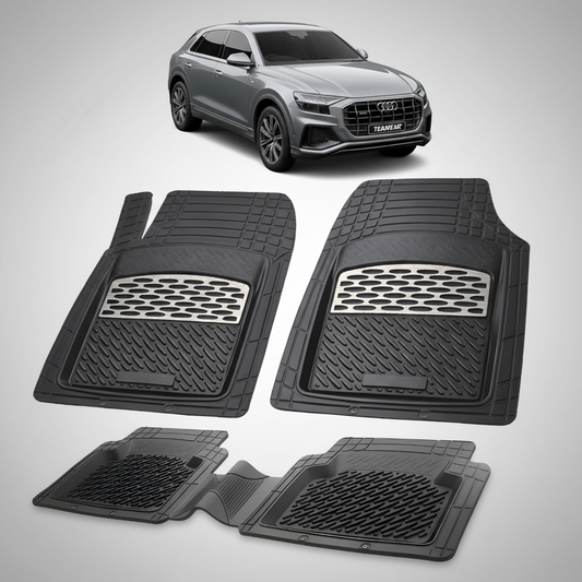 Set of black car floor mats with an Audi vehicle in the background