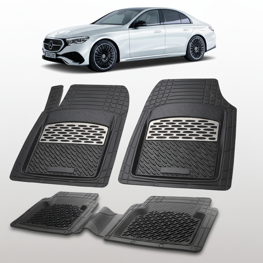 Set of black car floor mats with a white car in the background