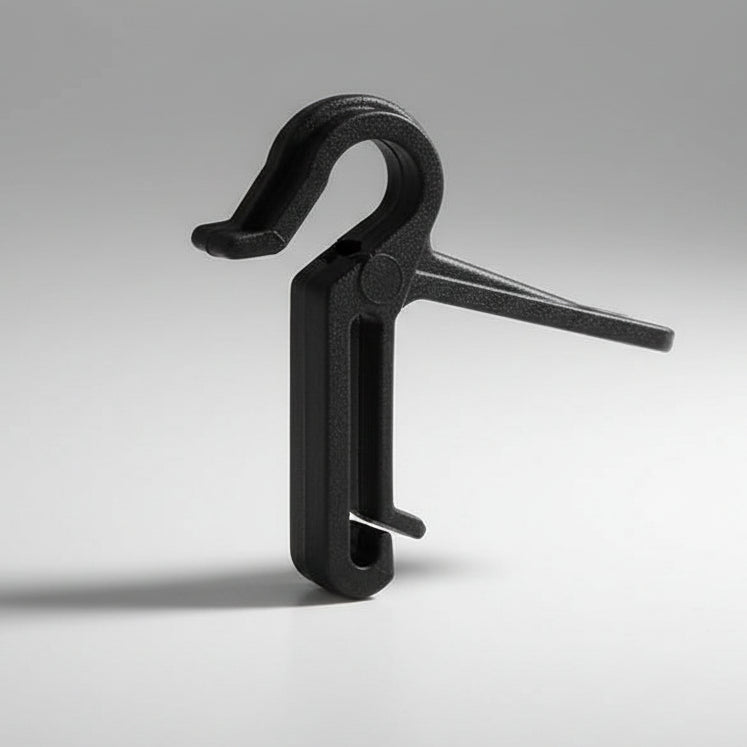 Black metal clip on a gray background