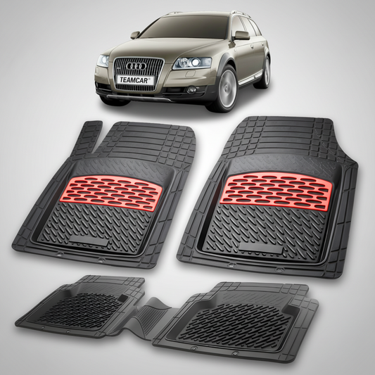 Set of black car floor mats with red accents in front of an Audi car.