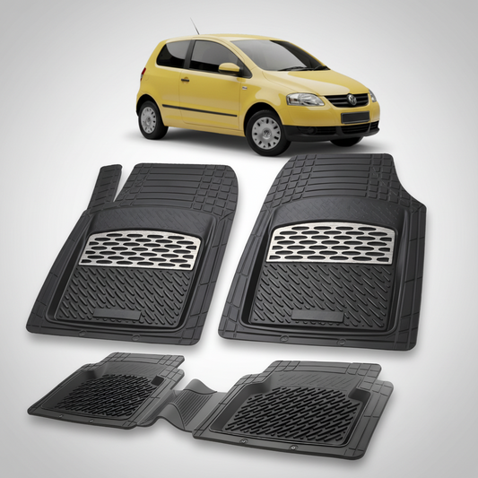 Set of black car floor mats with a yellow car in the background
