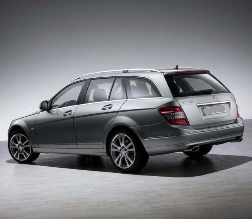 Silver Mercedes-Benz car on a gray background