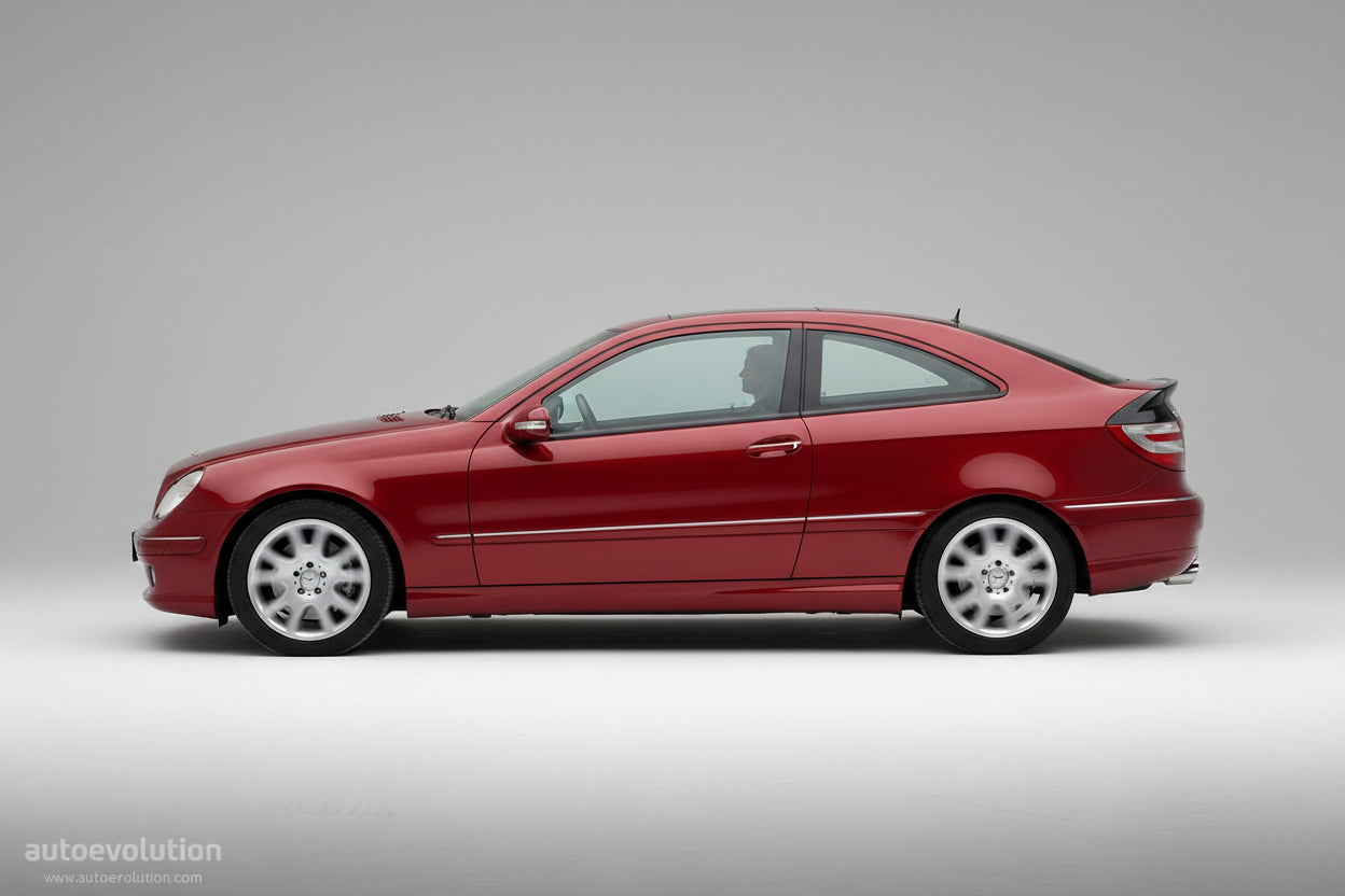 Red car driving on a road with a blurred green background